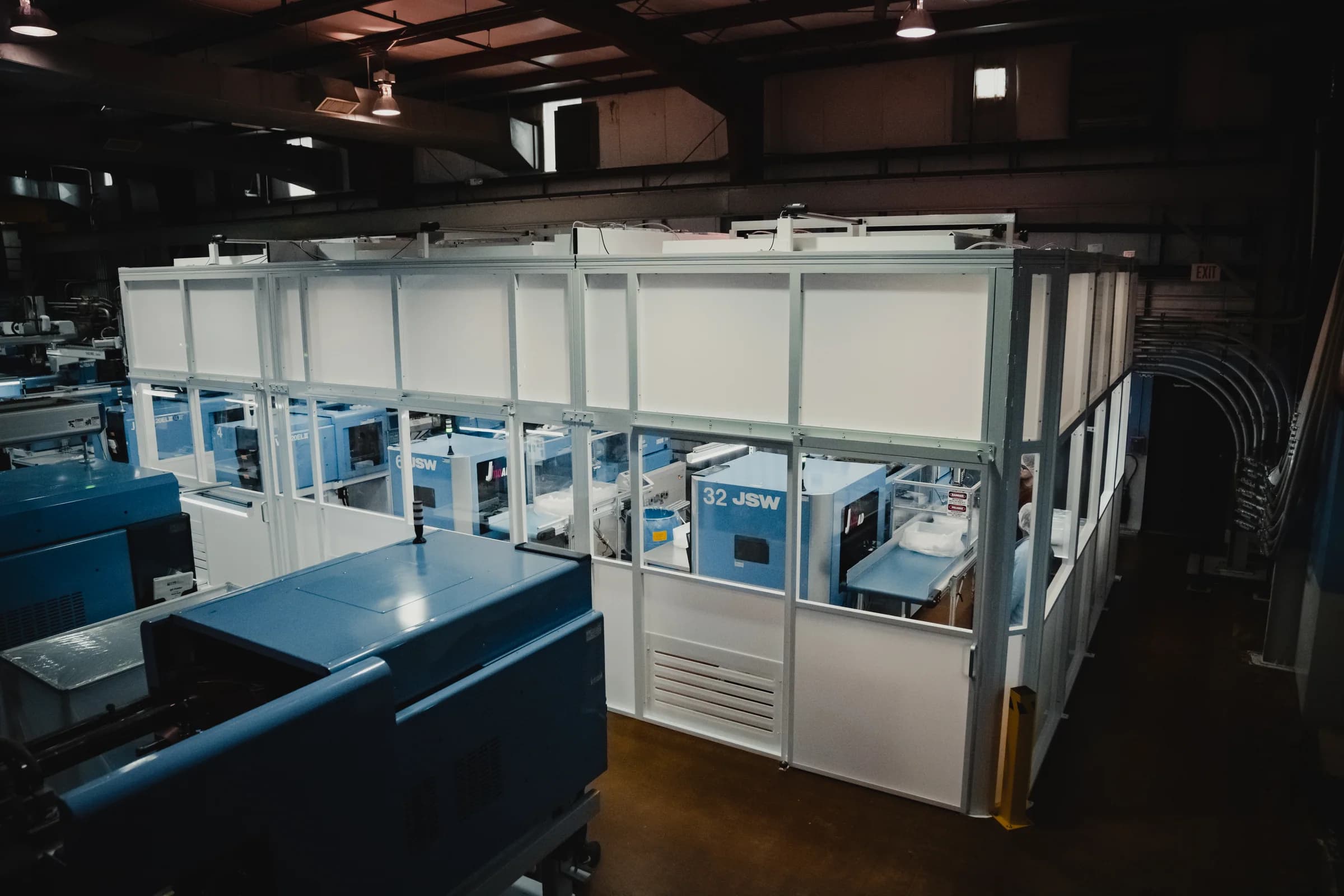 Enclosed molding equipment in a controlled production area