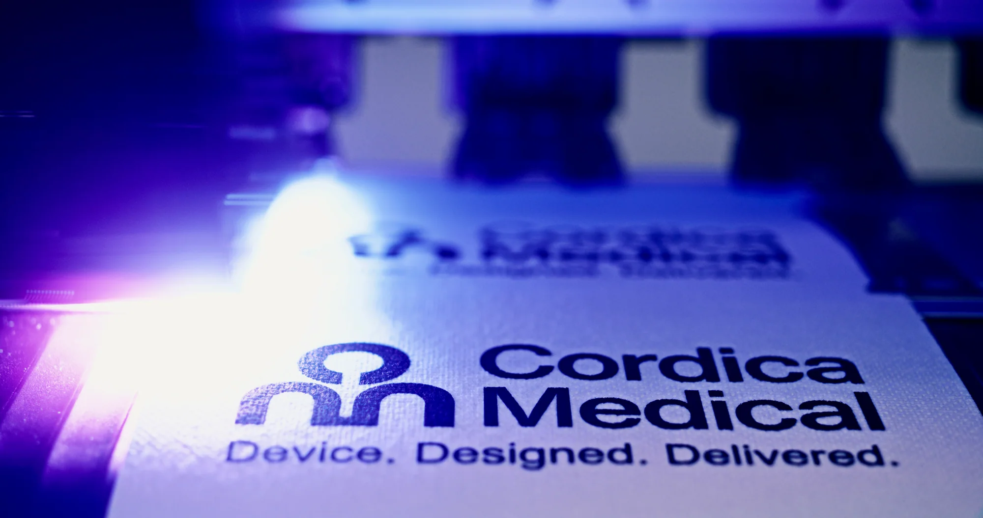 Cordica Medical name and Device. Designed. Delivered. tagline in blue-toned close-up