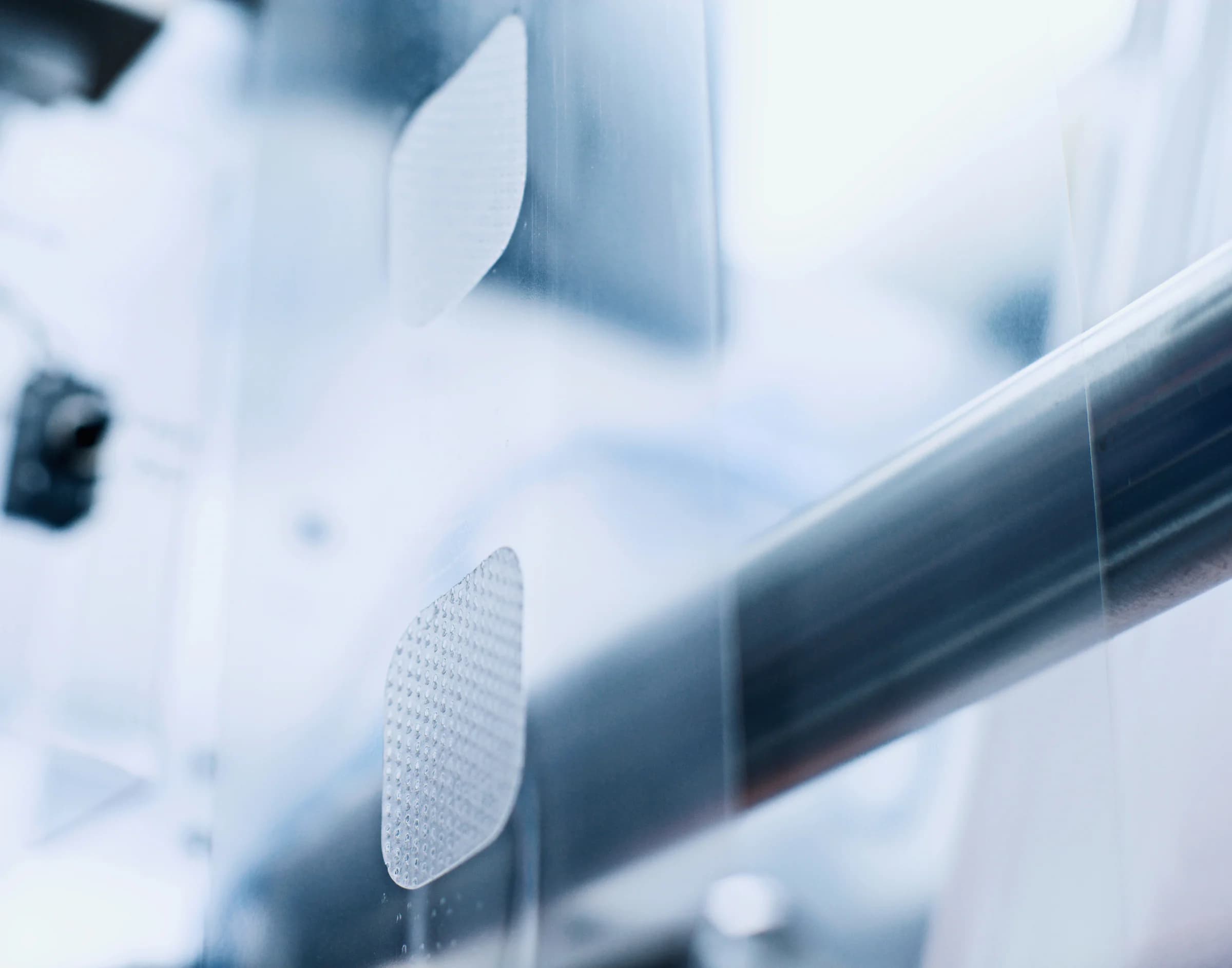 Flexible medical material web moving through a converting process