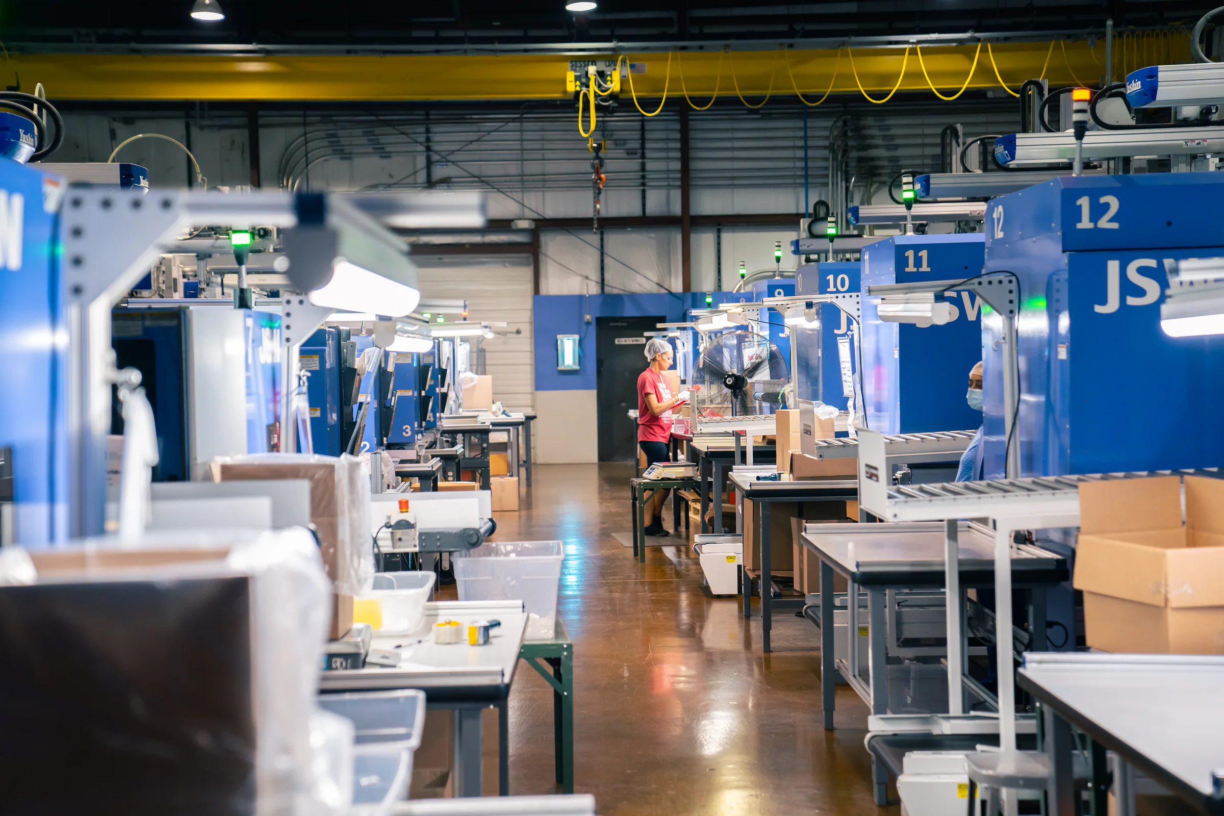Medical molding production floor with equipment and production personnel
